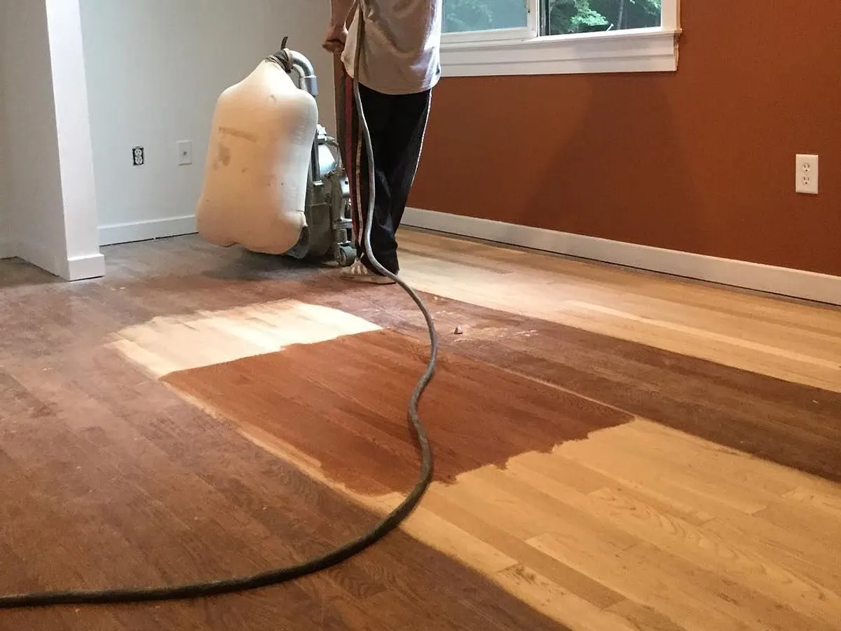 VGJ crew sanding the old finish off a bedroom floor